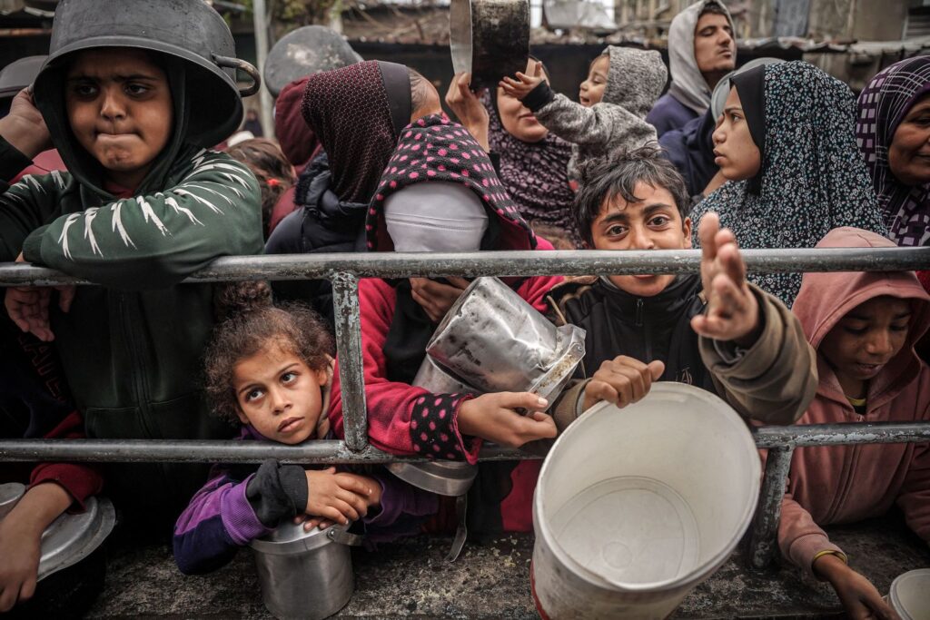 Gaza kids disparately waiting for some food as they are heading into famine in a month (Getty Images)